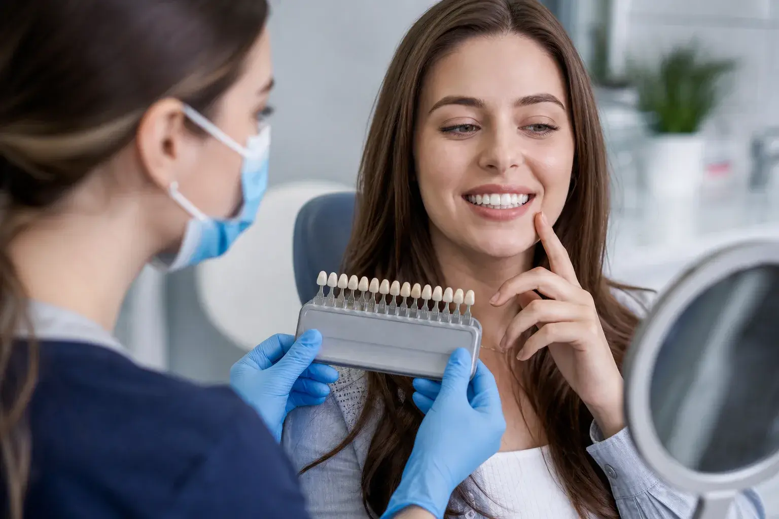 Soft toothbrush and nonabrasive paste beside porcelain veneer samples for daily veneer care