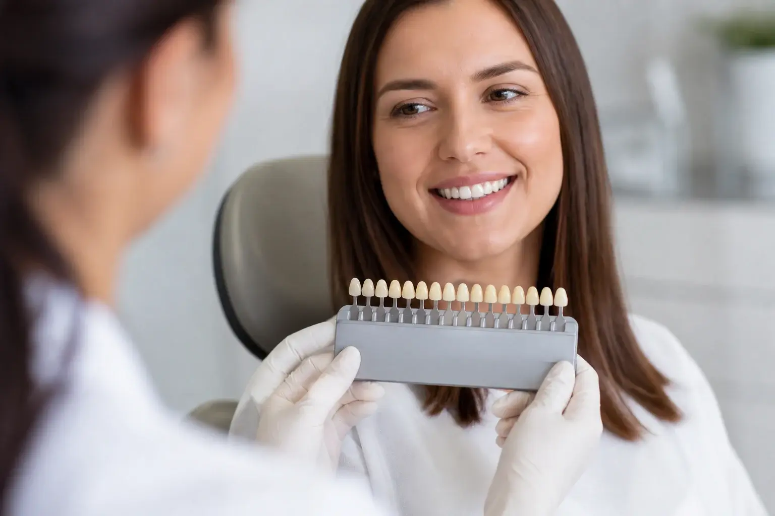 Bright smile consultation with shade guide and calendar showing how long teeth whitening results last