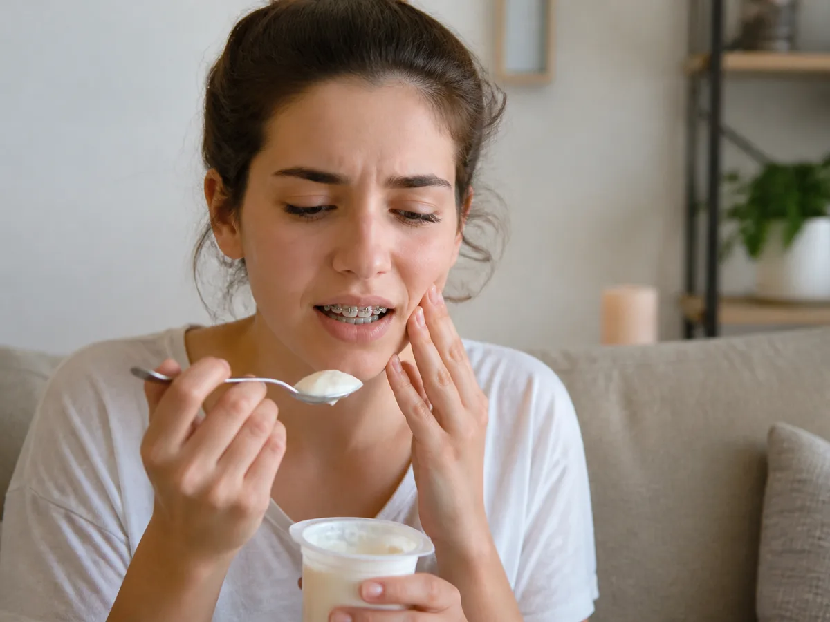 Orthodontic wax placed over a bracket that rubs the cheek