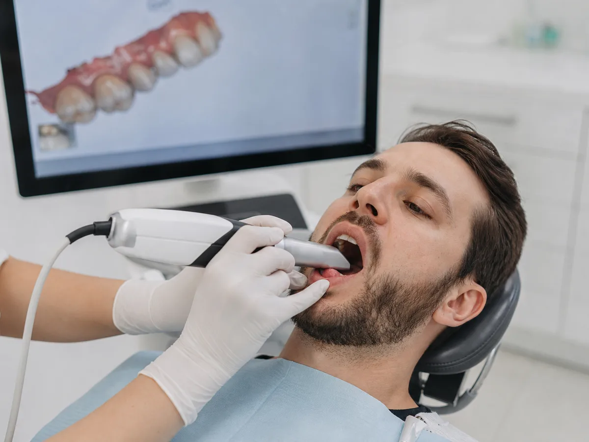 Dentist scanning a prepared tooth for a dental crown