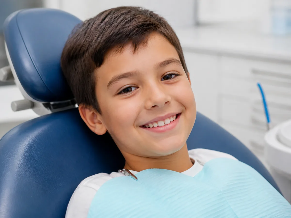 Pediatric dental hygienist reviewing a child's cavity risk chart