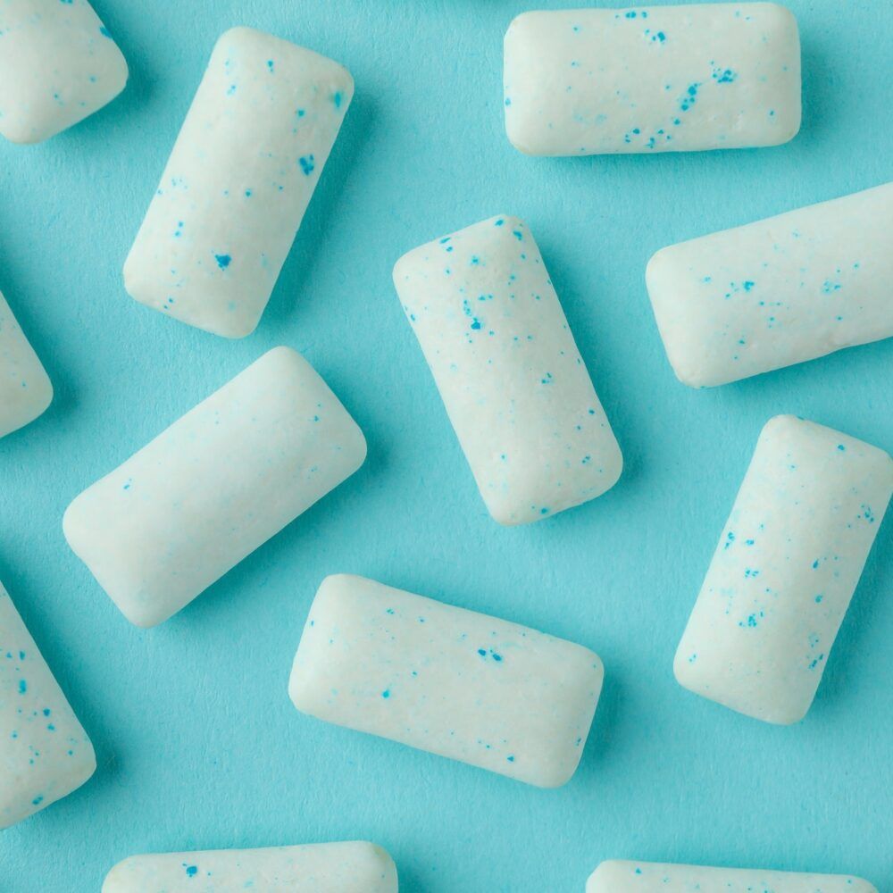 Chewing or bubble gum on blue background