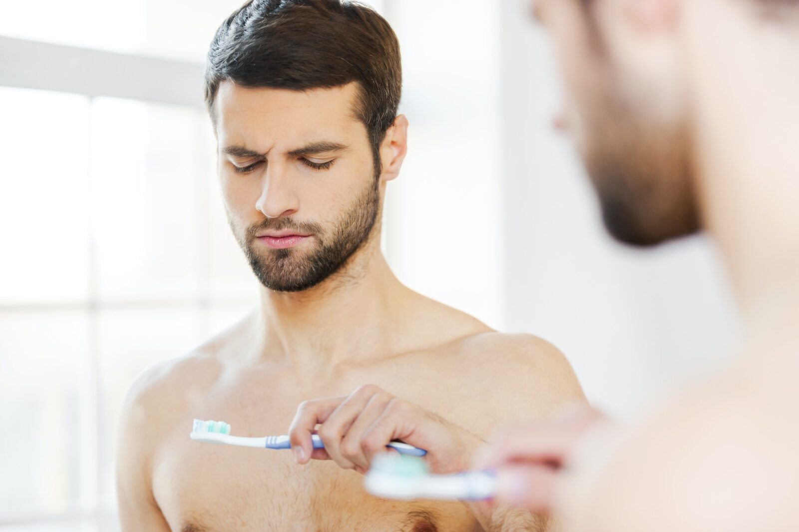 Feeling displeased with his new toothbrush.