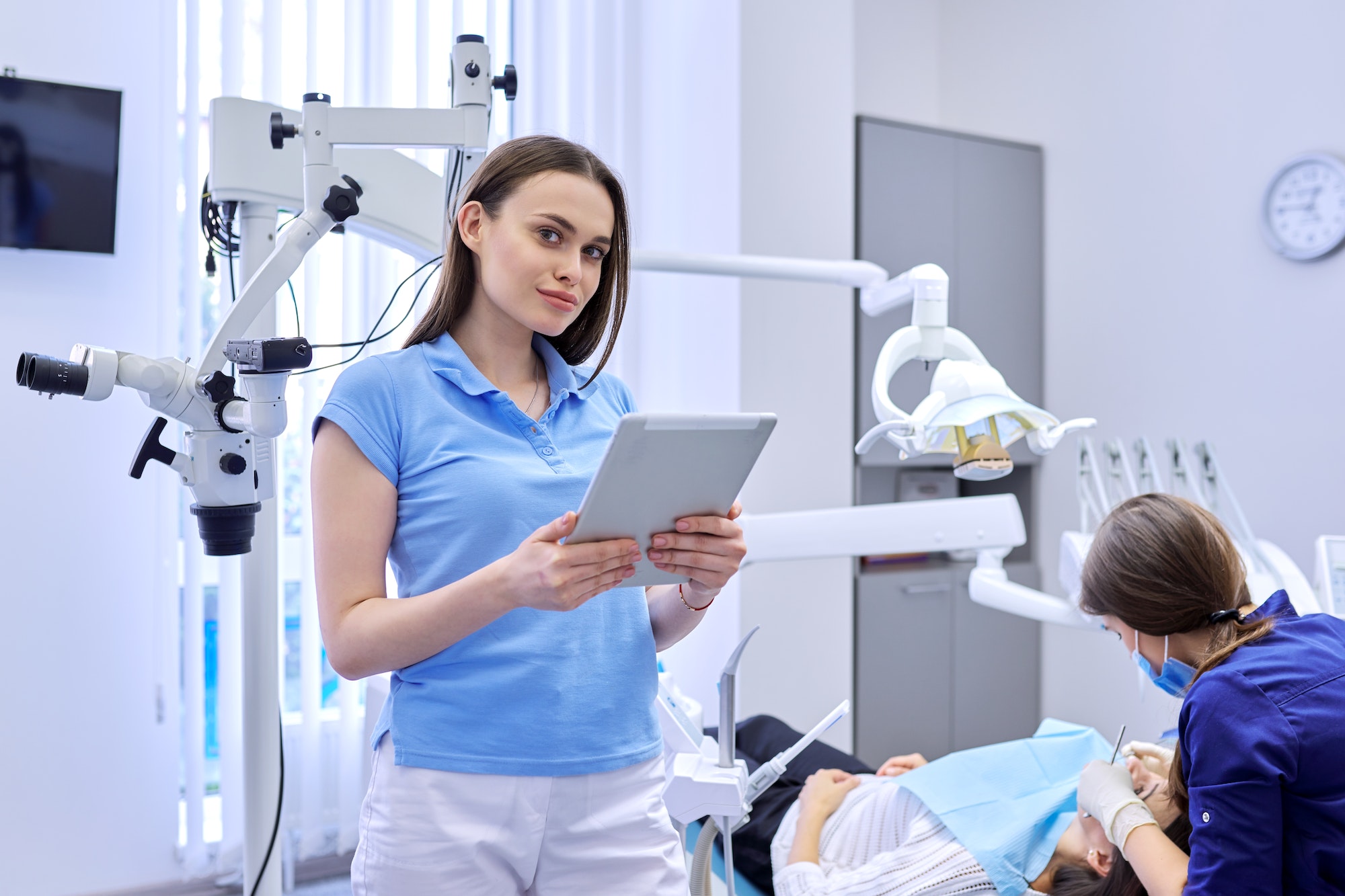 Portrait of dentist doctor with digital tablet