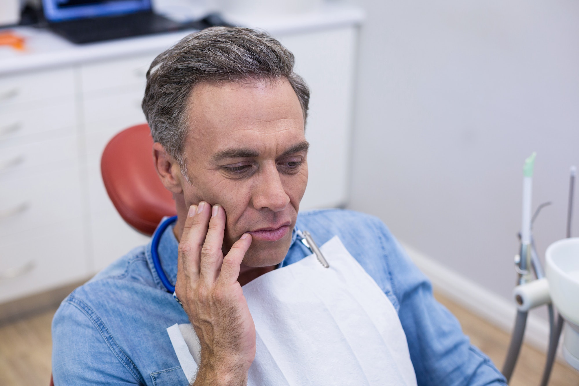 Unhappy man having a toothache