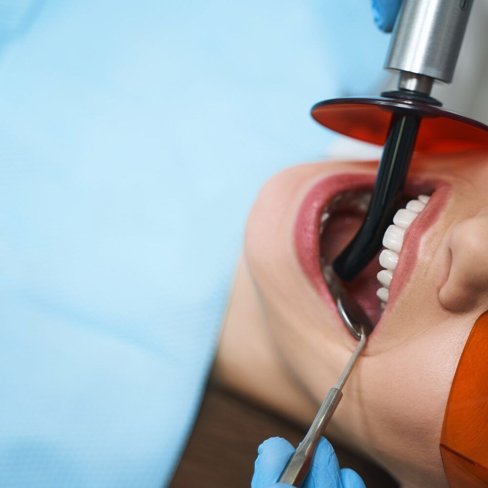 Woman is getting root canal stock photo