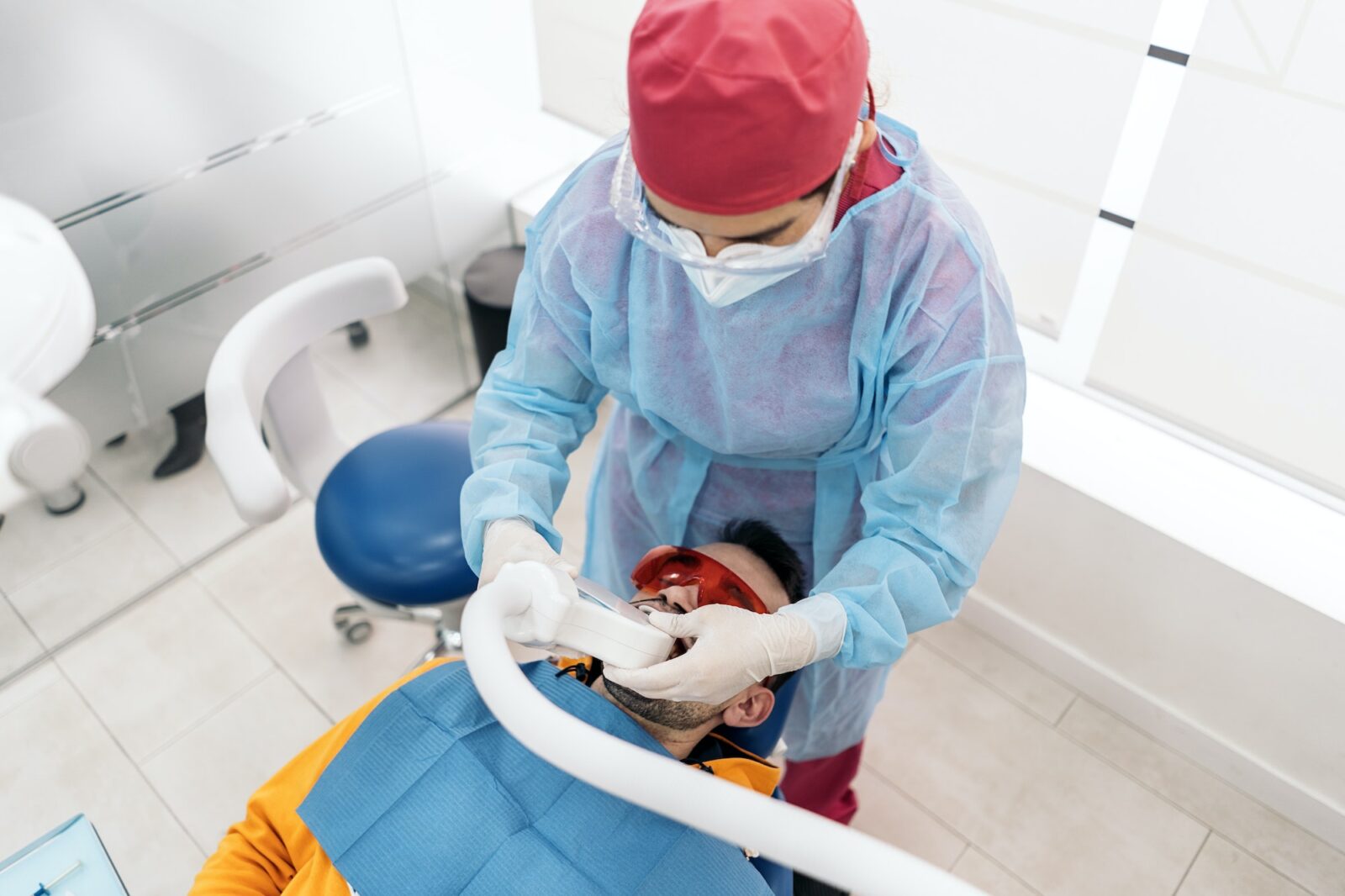 Man doing tooth whitening treatment