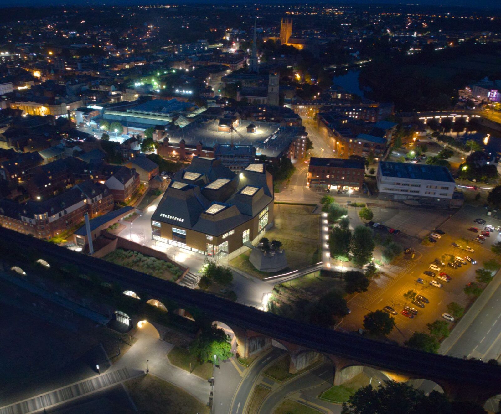 Drone shot of the illuminated Worcester city at night in Massachusetts, United States